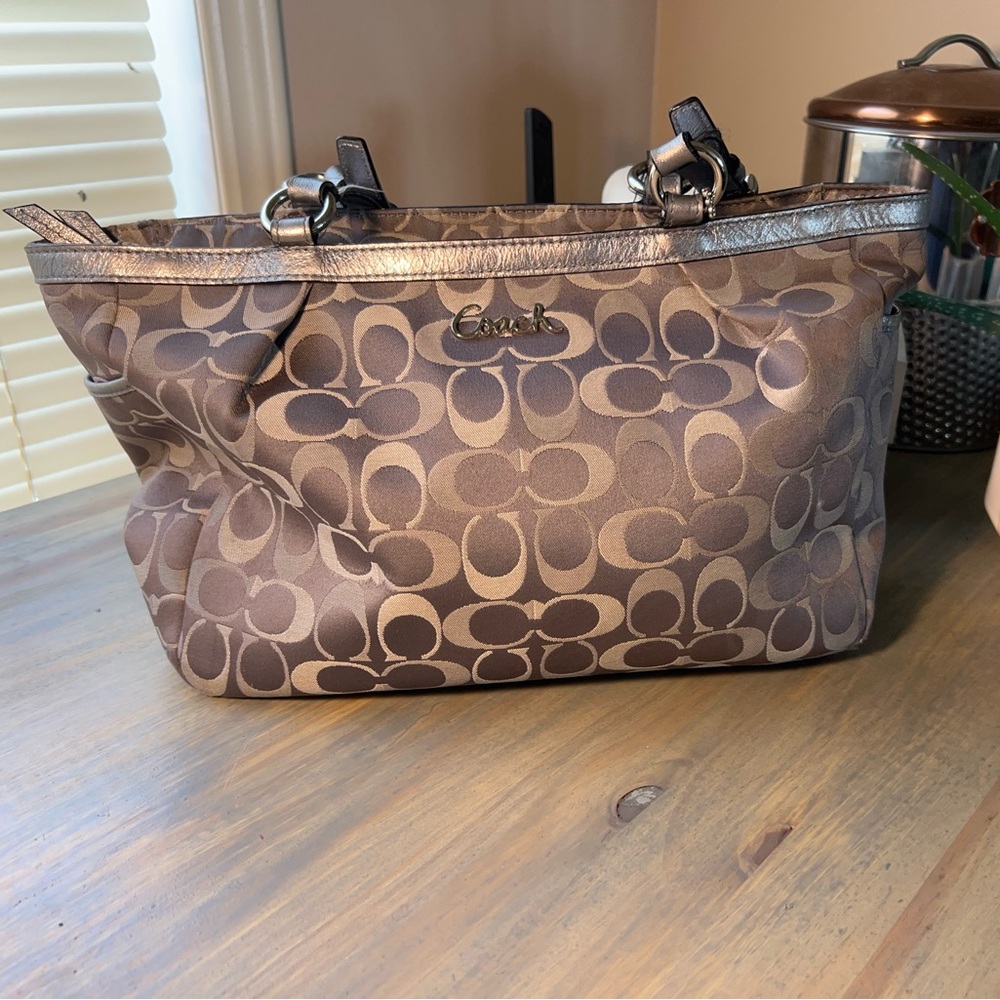 Midsized coach handbag.